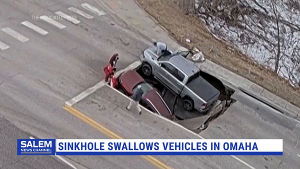 Sinkhole opens in Omaha, swallows SUV and pickup truck