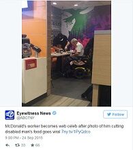 A McDonald's Employee Helping A Disabled Man Eat
