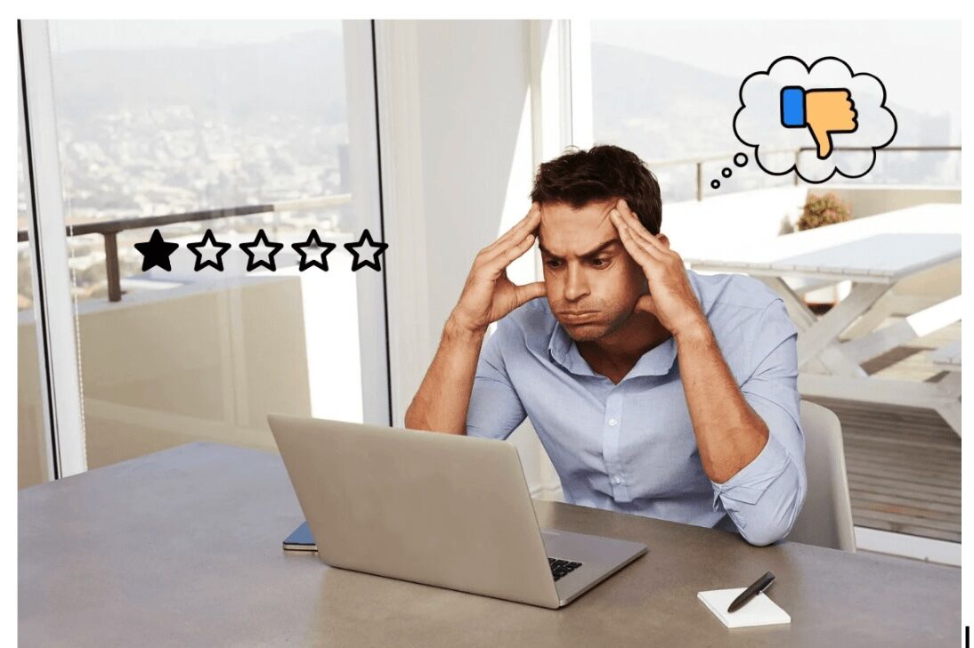A business owner reacts to a negative review on his laptop. Salem Surround’s reputation management services help businesses handle feedback and protect their brand image.