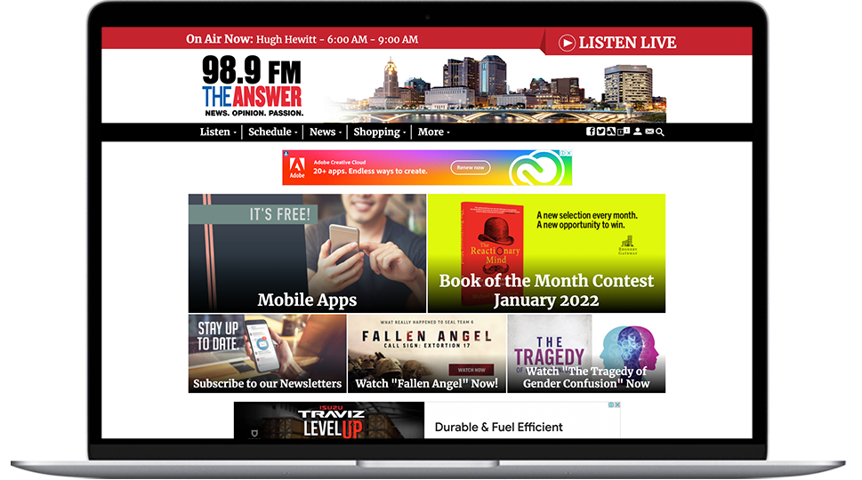 A laptop featuring a Columbus radio website