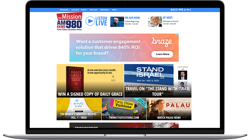 A laptop featuring a Minneapolis radio website