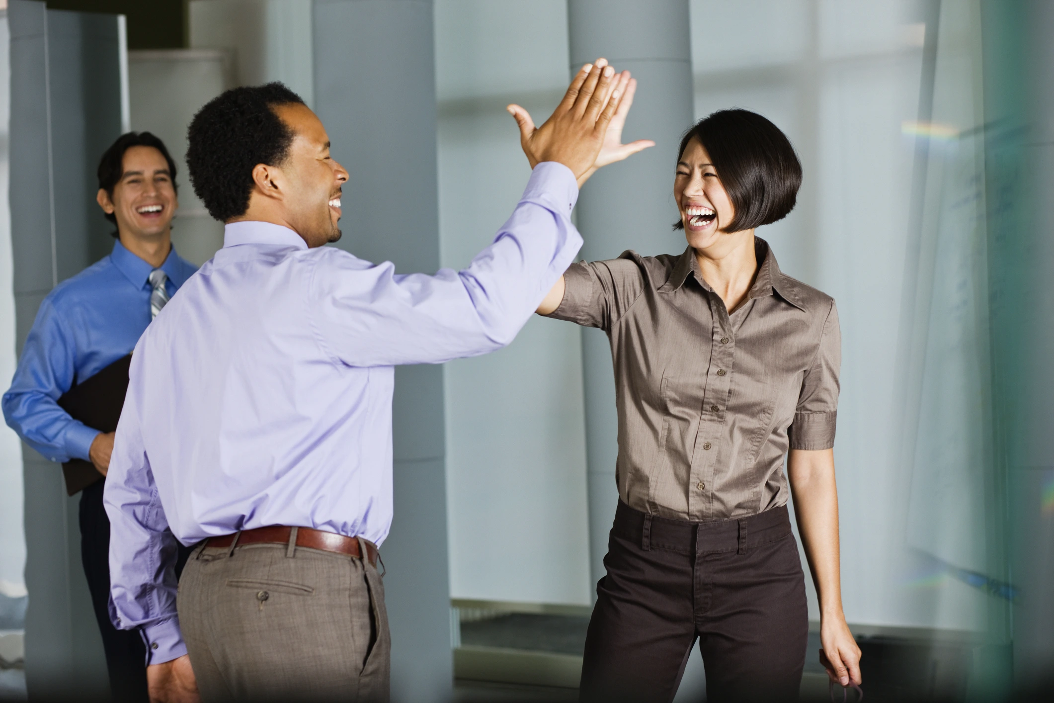 group of coworkers high fiving
