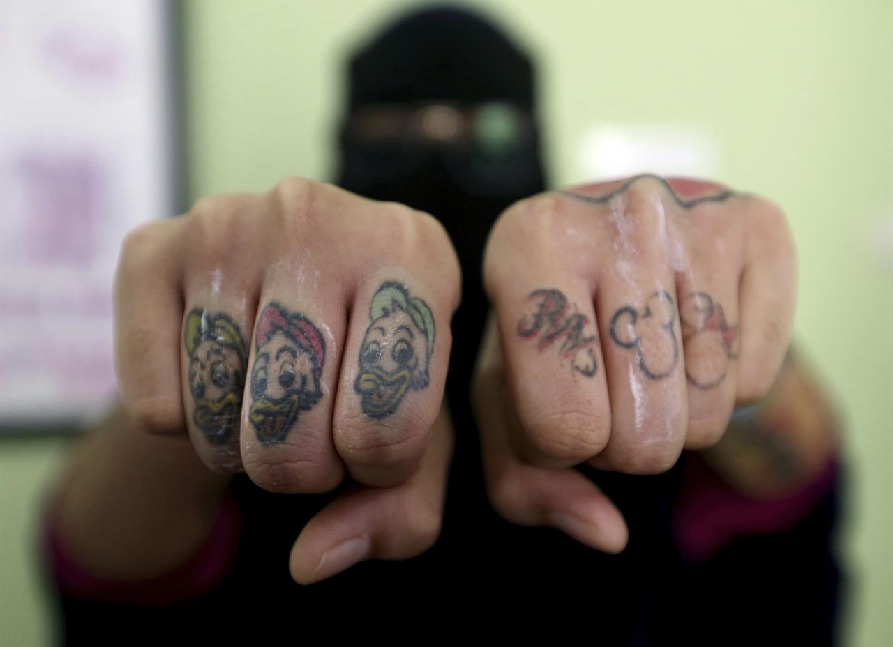 Indonesia clinic gives relief to Muslims with tattoo regrets | AM 1190