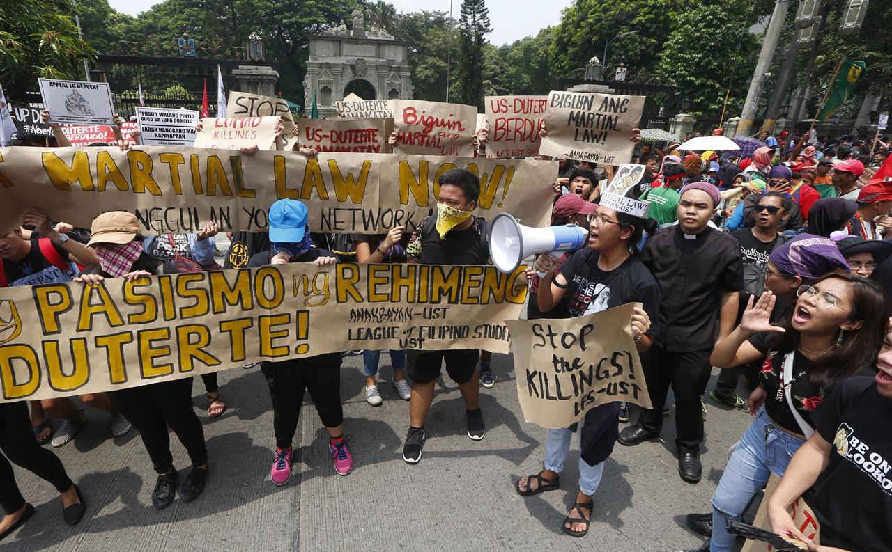 Filipino protesters slam martial law, killings under Duterte | 710 KNUS ...