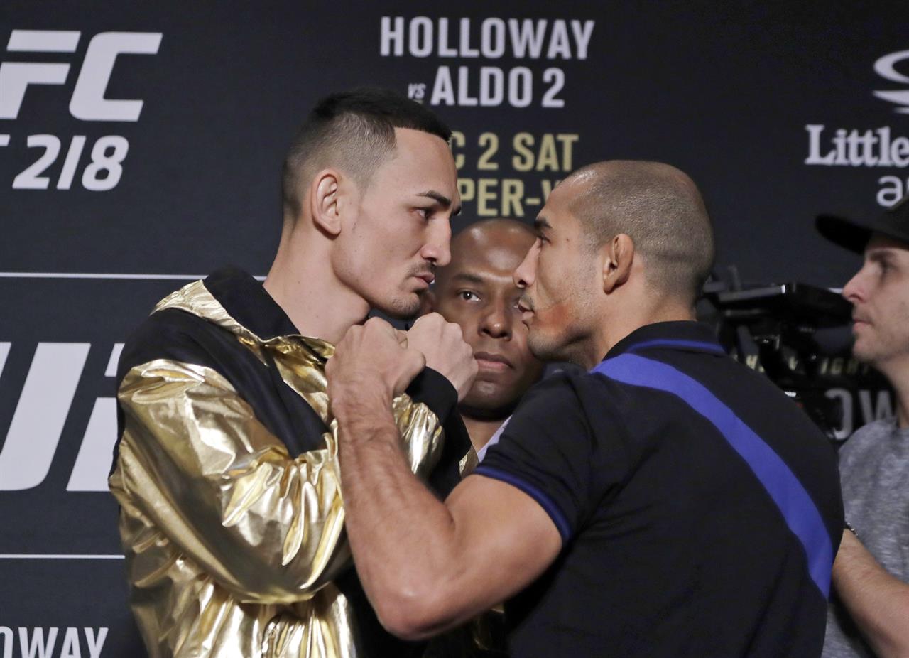 Holloway beats Aldo again, keeps UFC 