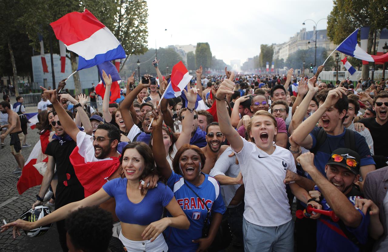 With flags, song, pride, French celebrate unifying victory | AM 1190