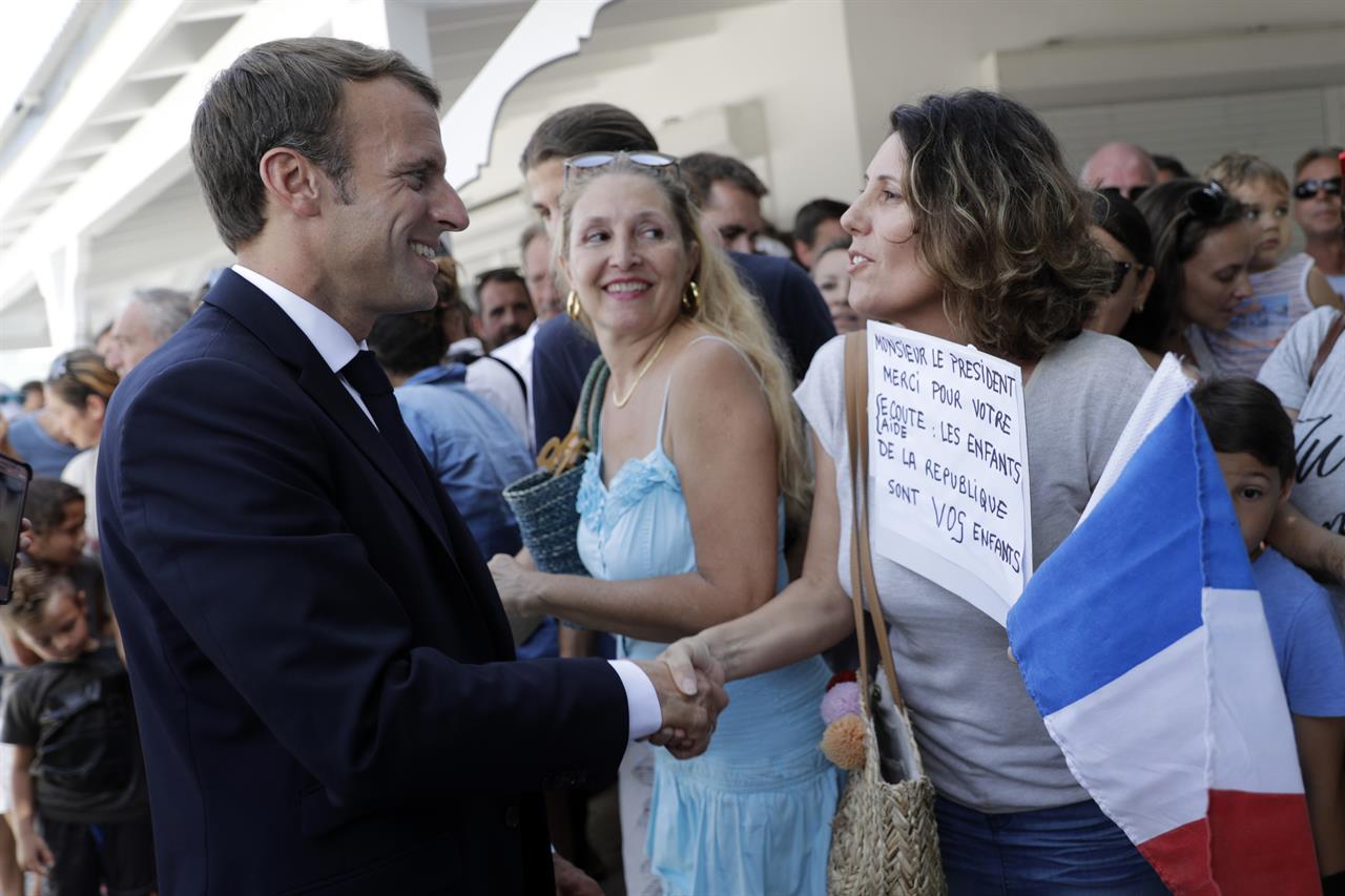 Macron criticized for photo with teen making obscene ...