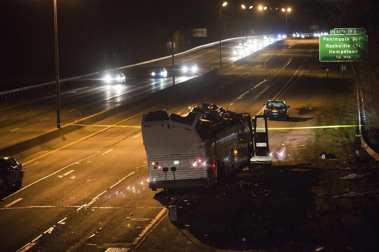 city bus hangs off overpass city bus hangs off overpass
