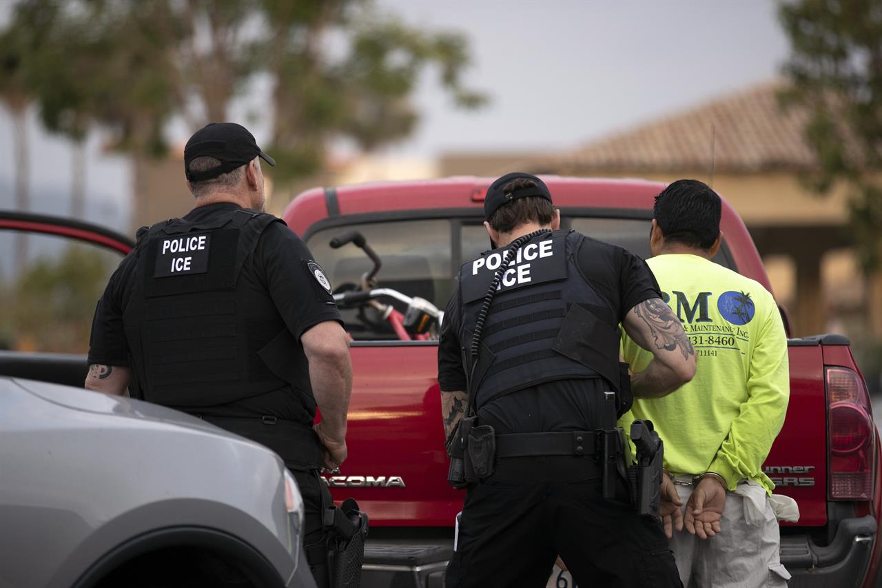 FILE - In this July 8, 2019 file photo, U.S. Immigration and Customs Enforcement (ICE) officers detain a man during an operation in Escondido, Calif. The administration of President Donald Trump announced Monday, July 22, 2019 that it will vastly expand the authority of immigration officers to deport migrants without allowing them to first appear before judges, its second major policy shift on immigration in eight days. Starting Tuesday, fast-track deportations can apply to anyone in the country illegally for less than two years. (AP Photo/Gregory Bull, File)
Trump expands fast-track deportation authority across US