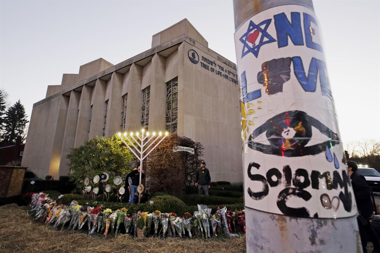 FILE - This Dec. 2, 2018, file photo shows a menorah at a memorial outside the Tree of Life Synagogue, where Robert Bowers killed worshippers in an Oct. 27 shooting, as people prepare for a celebration service at sundown on the first night of Hanukkah in the Squirrel Hill neighborhood of Pittsburgh. Bowers, charged with killing 11 worshippers at the Pittsburgh synagogue last year, has a court hearing Monday, Aug. 12, 2019. Prosecutors have not made a final decision on whether to seek the death penalty. Bowers is not expected to be in court. (AP Photo/Gene J. Puskar, File)
Hearing scheduled for synagogue massacre defendant