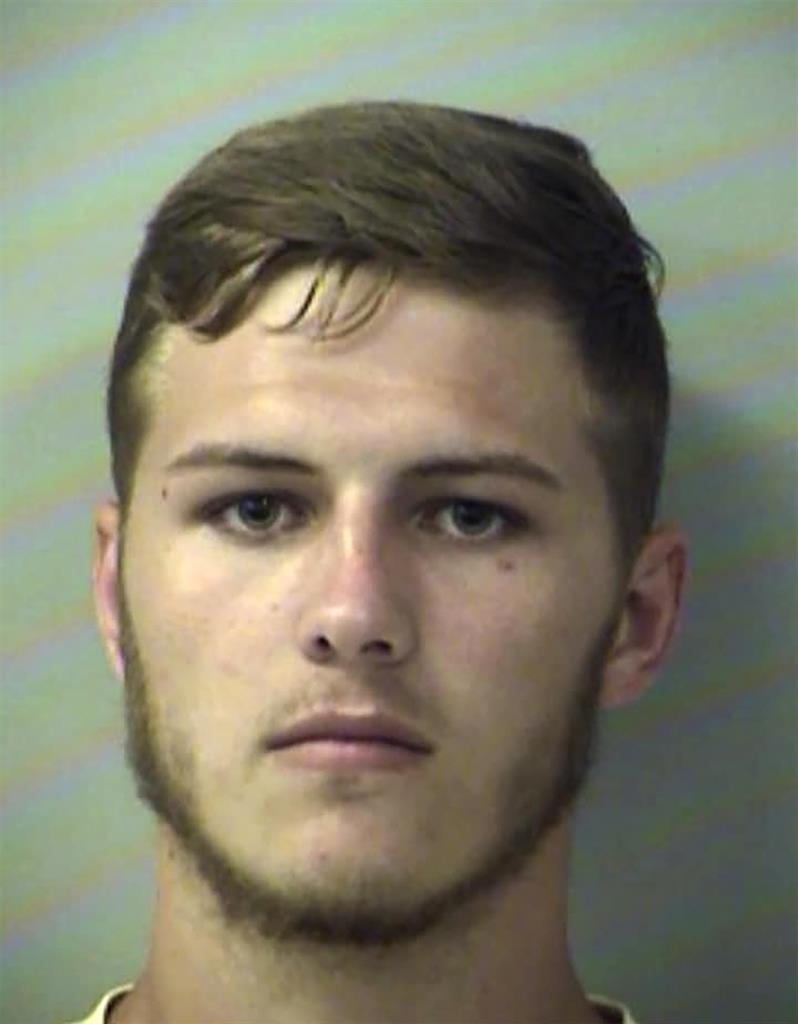In this Thursday, Aug. 15, 2019, booking photo from the Okaloosa County Sheriff's Office shows Hunter Mills. Authorities say the Florida man used a front-end loader to dump a large bucket full of dirt on a car with his girlfriend was inside. The Okaloosa County Sheriff's Office says Mills was charged with felony criminal mischief. (Okaloosa County Sheriff's Office via AP)
Sheriff: Florida man dumps dirt on girlfriend with tractor
