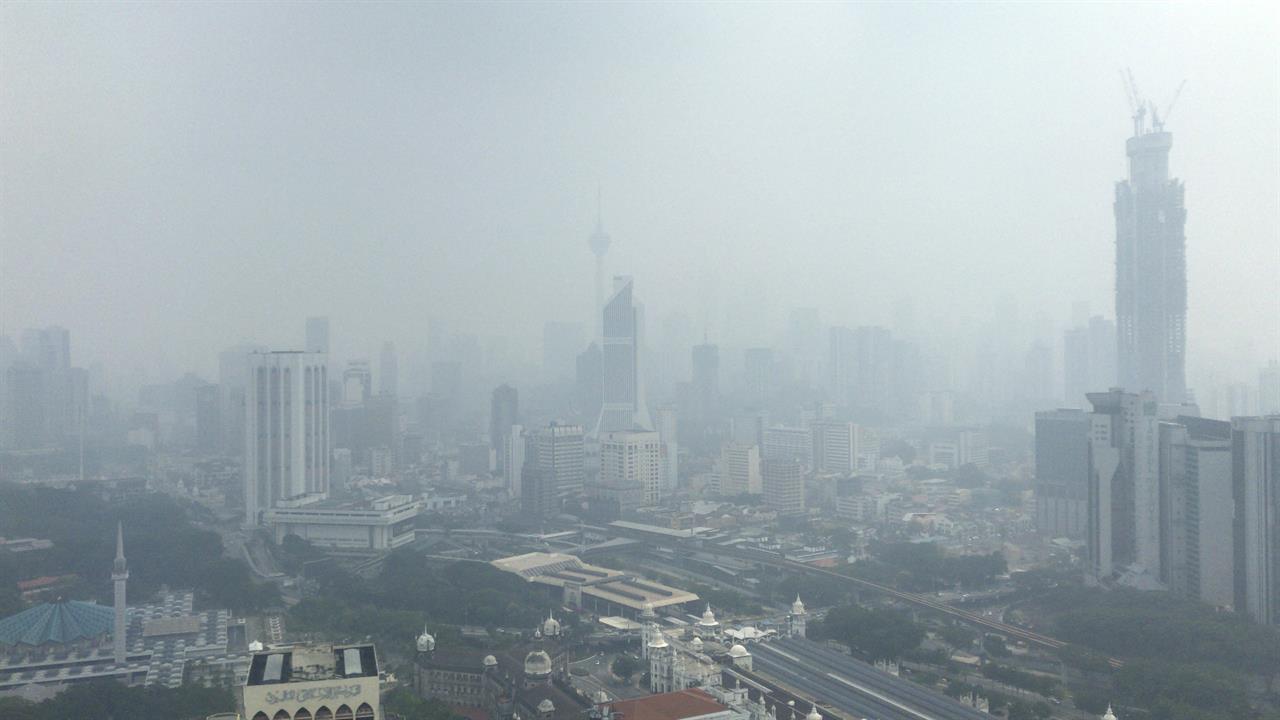 Kuala Lumpur city is shrouded with haze in Kuala Lumpur, Malaysia, Sunday, Sept. 15, 2019. Malaysia's government has banned open burning and conducted cloud-seeding in Sarawak on Thursday to induce rain to clear the choking haze. (AP Photo)
Indonesian police arrest 185 over forest fires