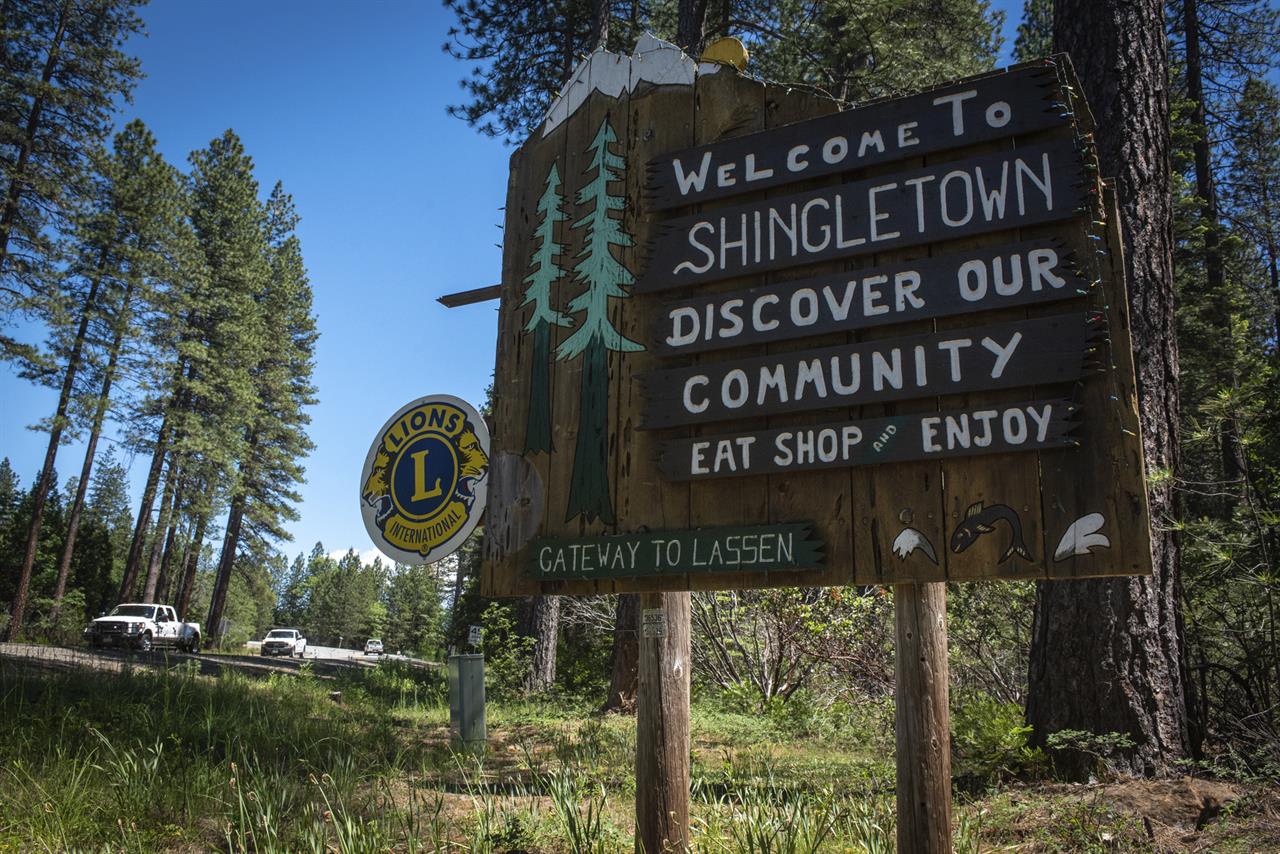 In this photo taken June 11, 2019, is a sign outside Shingletown, Calif. The town got its name from its heyday making wooden roofing materials. The wildfire-vulnerable town has two nicknames, Little Paradise and Gateway to Mount Lassen. Despite federal fire suppression costs quadrupling and an increase in employed firefighters, the damages caused by wildfires has increased fivefold. (Anton L. Delgado/News21 via AP)
Communities search for ways to live with growing fire threat