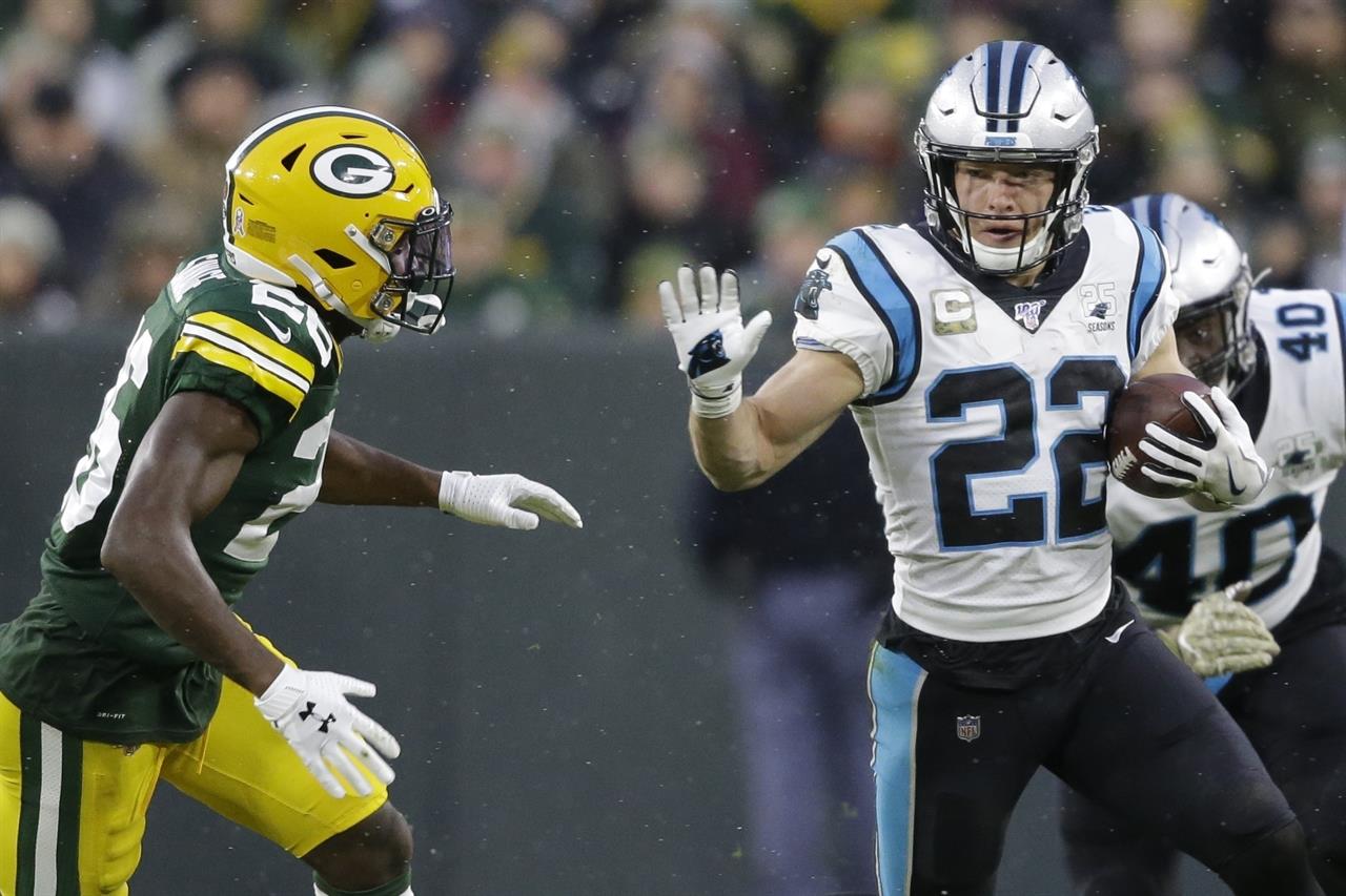 FILE - In this Nov. 10, 2019, file photo, Carolina Panthers' Christian McCaffrey (22) runs during the first half of an NFL football game against the Green Bay Packers in Green Bay, Wis. McCaffrey is on a record pace even as his team struggles, putting him in high on the list of AP MVP candidates. (AP Photo/Jeffrey Phelps, File)
AP MVP is not just for QBs and is far from decided