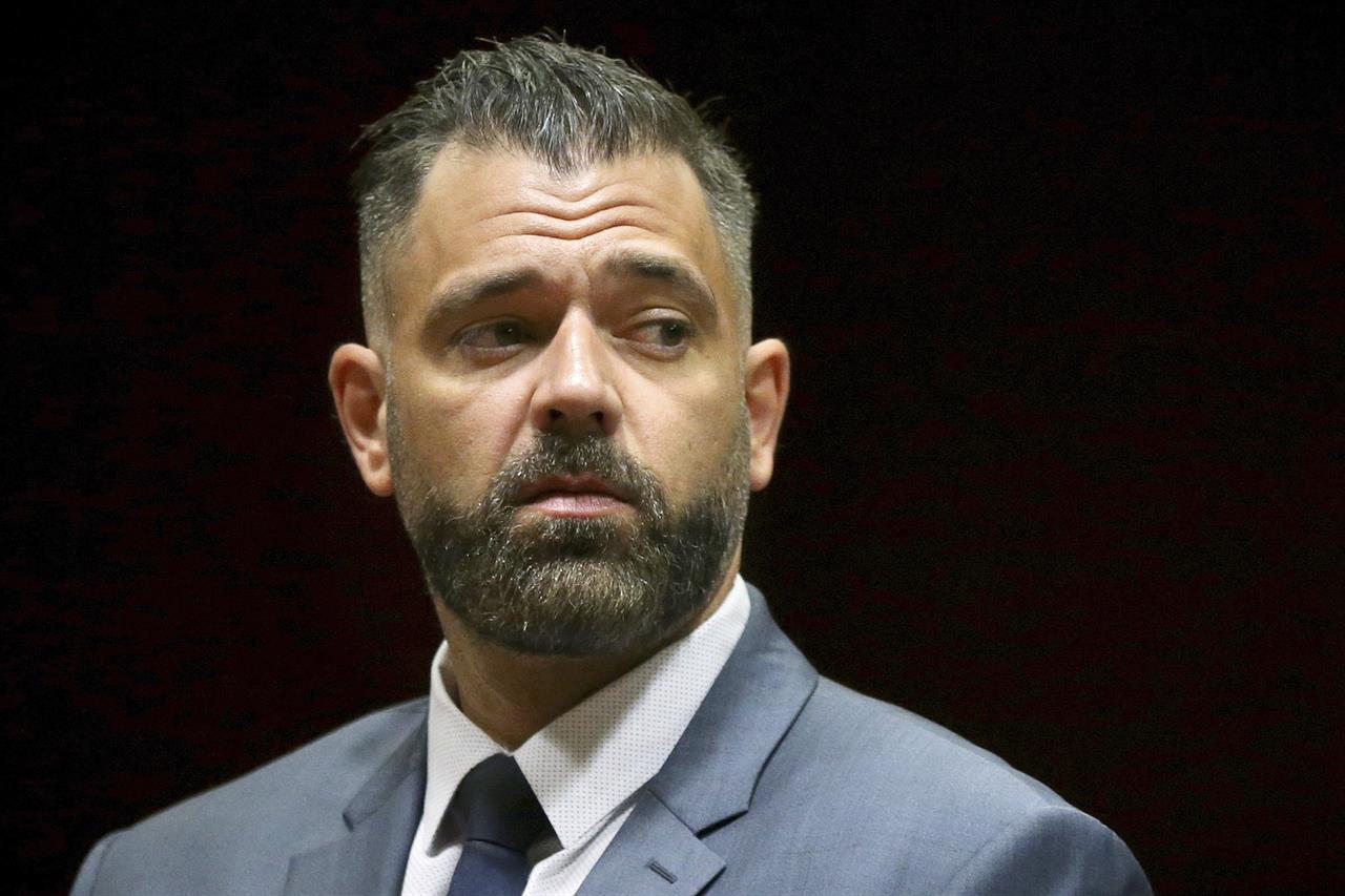FILE - In this May 28, 2019 file photo, Mark D'Amico stands before pleading not guilty during his arraignment to charges including theft by deception at Burlington County Superior Court in Mount Holly, N.J. D'Amico pleaded guilty Friday, Dec. 6, to a state charge stemming from a scheme that raked in more than $400,000 in online donations with a phony story about a homeless veteran. (Tim Tai/The Philadelphia Inquirer via AP, Pool, File)