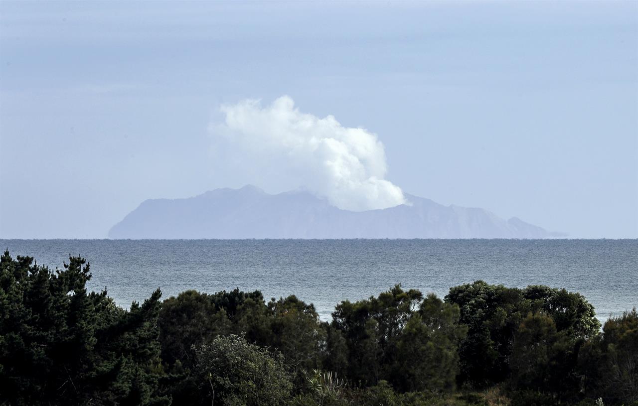 Plumes of steam rise above White Island off the coast of Whakatane, New Zealand, Wednesday, Dec. 11, 2019. Survivors of a powerful volcanic eruption in New Zealand on Monday Dec. 9 ran into the sea to escape the scalding steam and ash and emerged covered in burns, say those who first helped them.(AP Photo/Mark Baker)
New Zealand volcano vents steam, death toll now at 16