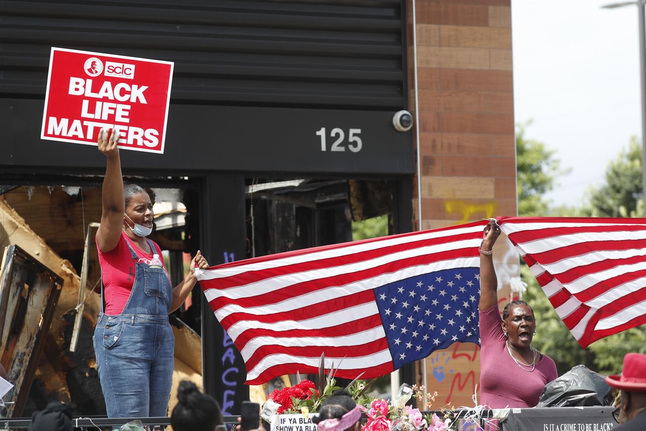 Protesters chant outside a Wendy's restaurant on Tuesday, June 23, 2020, in Atlanta after a funeral for Rayshard Brooks was held. Brooks died after being fatally shot by an Atlanta police officer. (AP Photo/John Bazemore)
Georgia Gov. authorizes Guard troops after 8-year-old killed