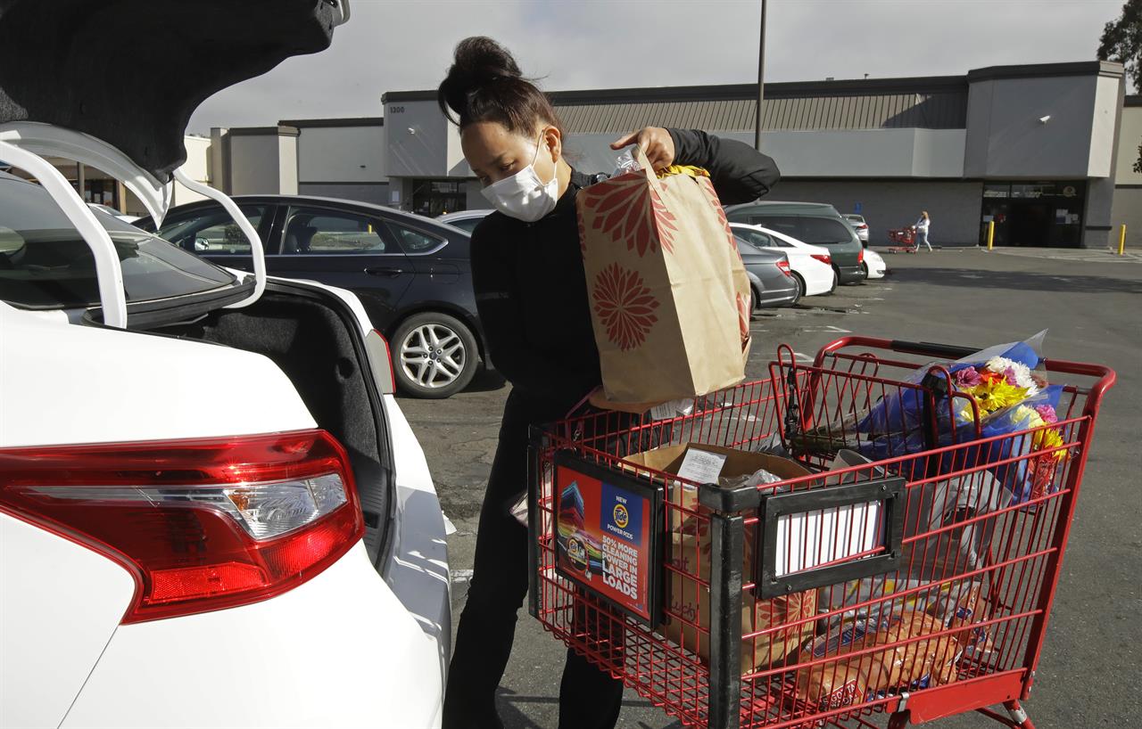 Instacart worker Saori Okawa loads groceries into her car for home delivery on Wednesday, July 1, 2020, in San Leandro, Calif. Okawa is one of an estimated 1.5 million so-called gig workers who make a living driving people to airports, picking out produce at grocery stores or providing childcare for working parents. But with the pandemic pummeling the global economy and U.S. unemployment reaching heights not seen since the Great Depression, gig workers are clamoring for jobs that often pay less while facing stiff competition from a crush of newly unemployed workers also attempting to patch together a livelihood until the economy recovers. (AP Photo/Ben Margot)
Gig workers face shifting roles, competition in pandemic