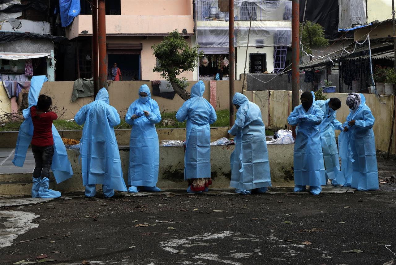 Health workers get into their gear screen residents for COVID-19 symptoms at Deonar slum in Mumbai, India, Saturday, July 11, 2020. In just three weeks, India went from the world’s sixth worst-affected country by the coronavirus to the third, according to a tally by Johns Hopkins University. India's fragile health system was bolstered during a stringent monthslong lockdown but could still be overwhelmed by an exponential rise in infections. (AP Photo/Rajanish Kakade)
The Latest: Mexico tops 35,000 deaths, 4th highest toll