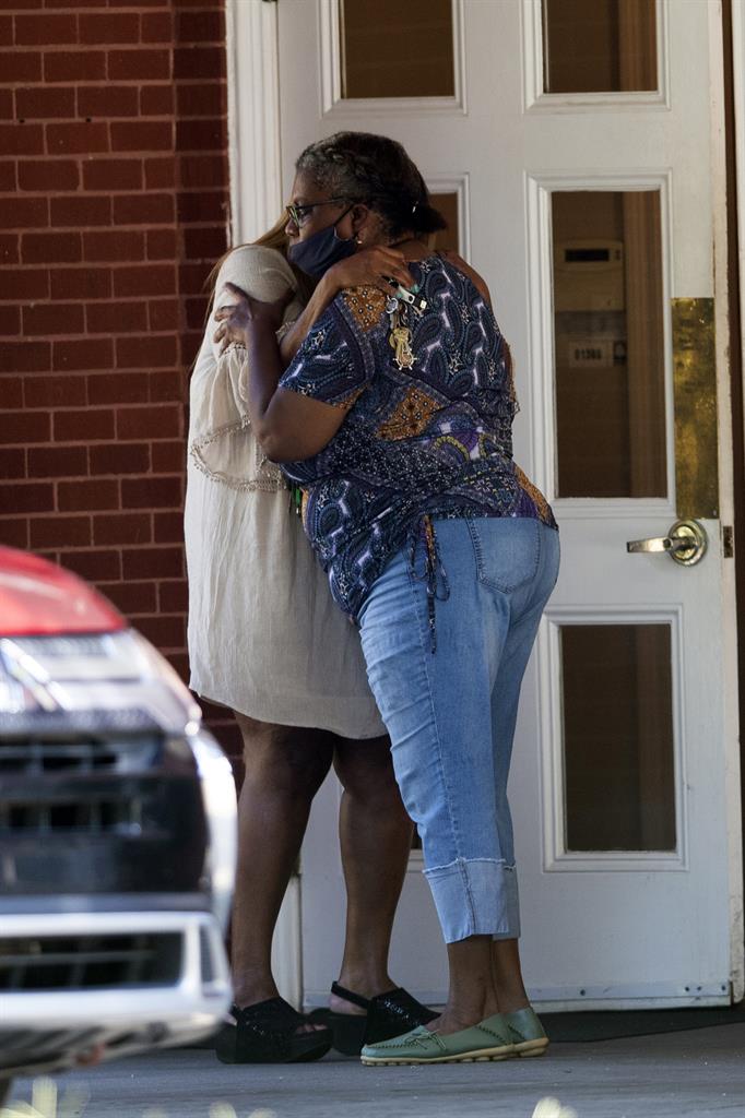 Two women embrace outside a viewing for 8-year-old Secoriea Turner, who was fatally shot in Atlanta on July 4th near the Wendy's site where Rayshard Brooks was killed the previous month Tuesday, July 14, 2020, in South Fulton, Ga. (AP Photo/John Bazemore)
Mourners pay final respects to girl shot to death in Atlanta