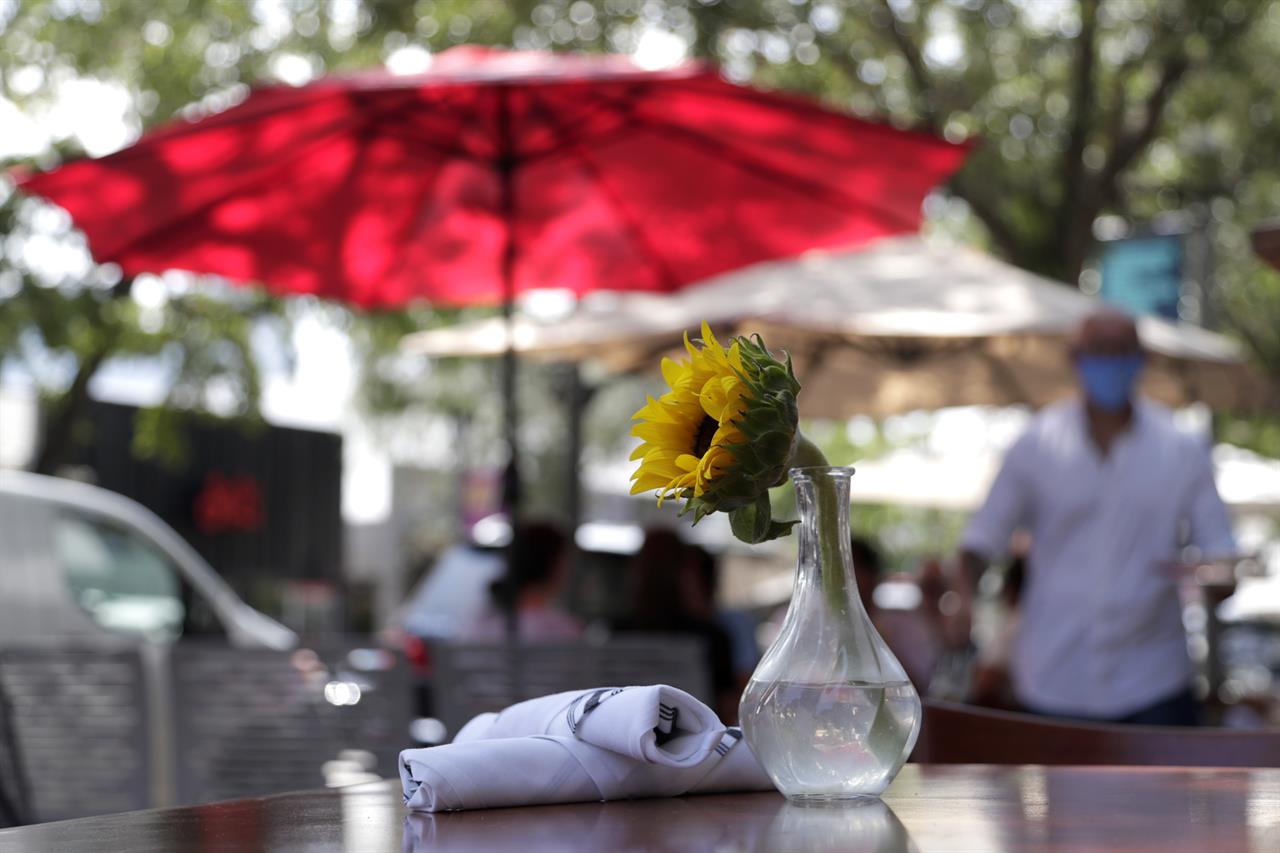 An outdoor table is ready for customers at Loretta and the Butcher restaurant during the coronavirus pandemic, Thursday, Aug. 6, 2020, in the Coconut Grove neighborhood in Miami. Restaurants continue to offer outdoor dining and take-out only, with indoor dining still not permitted in Miami-Dade County. (AP Photo/Lynne Sladky)
Fed's Main Street pandemic support program off to slow start