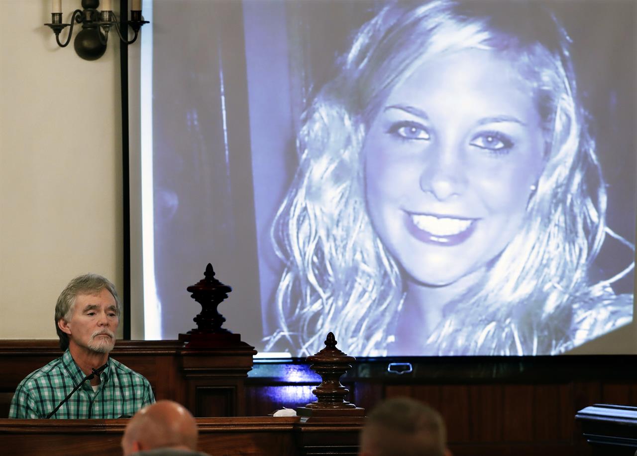 FILE - In this Sept. 11, 2017 file photo, Dana Bobo, let, father of Holly Bobo testifies in the trial of Zachary Adams as a photo of Holly Bobo is displayed in Savannah, Tenn. Jason Autry pleaded guilty Monday, Sept. 14, 2020 to taking part in the killing of Tennessee nursing student Holly Bobo more than nine years ago, but he is expected to be released soon as part of a deal with prosecutors. (AP Photo/Mark Humphrey, Pool, File)
Tennessee convict pleads guilty in Holly Bobo murder case