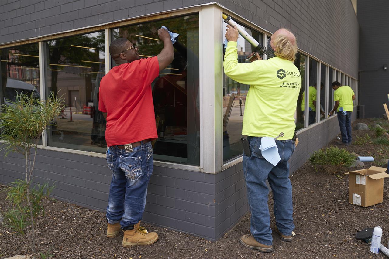 Workers replace windows smashed in May 2020, at a business in downtown Omaha, Neb., Wednesday, Sept. 16, 2020, one day after a grand jury decided to charge a white business owner who fatally shot Black James Scurlock during civil unrest in downtown Omaha this spring with manslaughter and other charges. This week's decision to charge Jake Gardner, a white bar owner who fatally shot James Scurlock, a Black man, during a chaotic night of protests in downtown Omaha months after the shooting was initially deemed self-defense highlights how difficult it can be to sort out these cases. (AP Photo/Nati Harnik)
New evidence key to charges in Nebraska protester's death