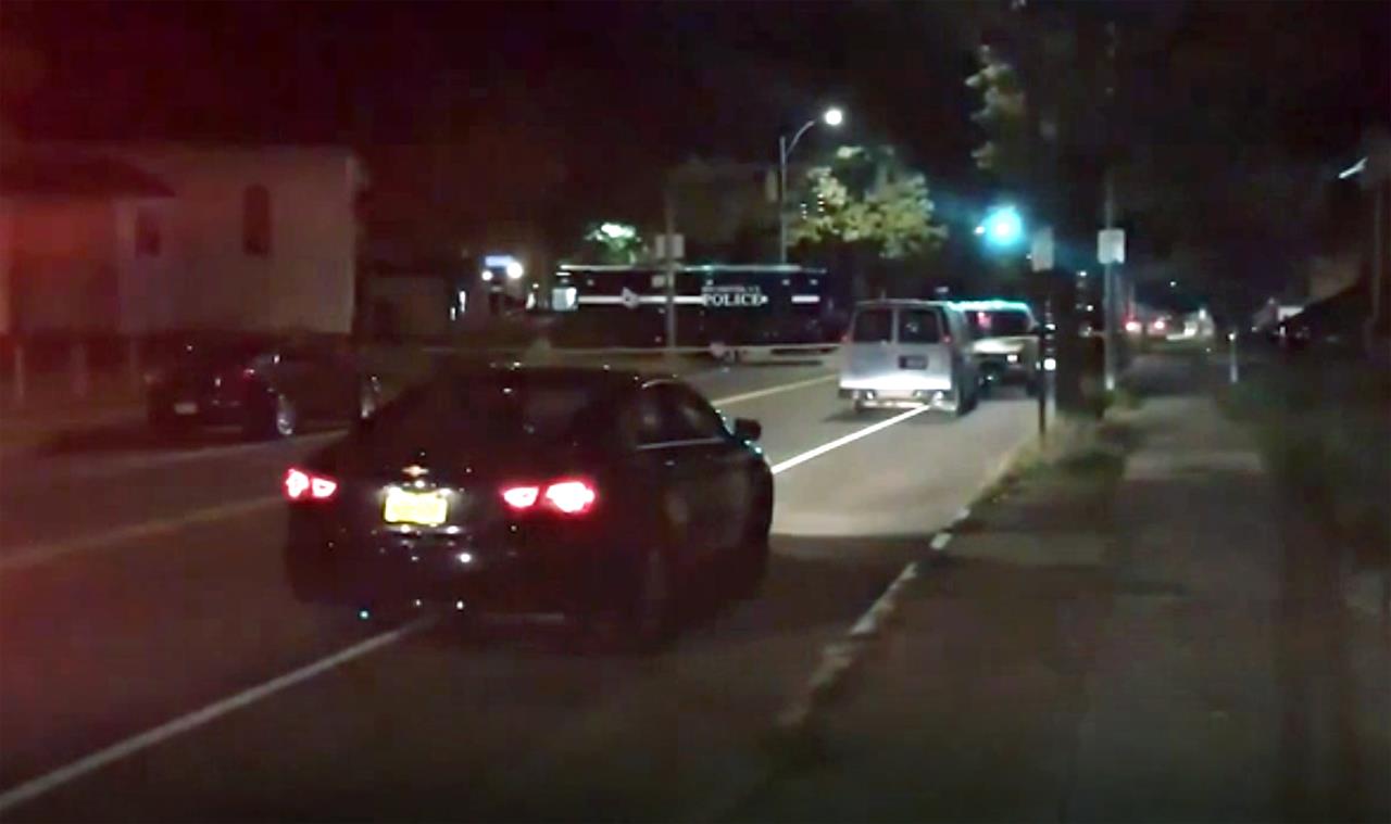 Police respond to the scene of a shooting early Saturday, Sept. 19, 2020 in Rochester, N.Y. As many as 100 people were at a backyard party when the shooting started just before 12:30 a.m., Acting Police Chief Mark Simmons told reporters. (13 WHAM via AP)