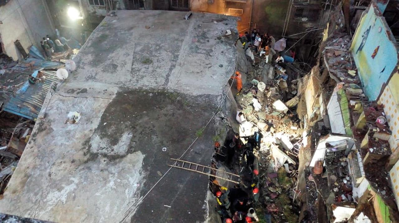This photograph provided by India’s National Disaster Response Force (NDRF) shows rescuers at the site after a residential building collapsed in Bhiwandi in Thane district, a suburb of Mumbai, India, Monday, Sept.21, 2020. (National Disaster Response Force via AP)
At least 10 dead in residential building collapse in India