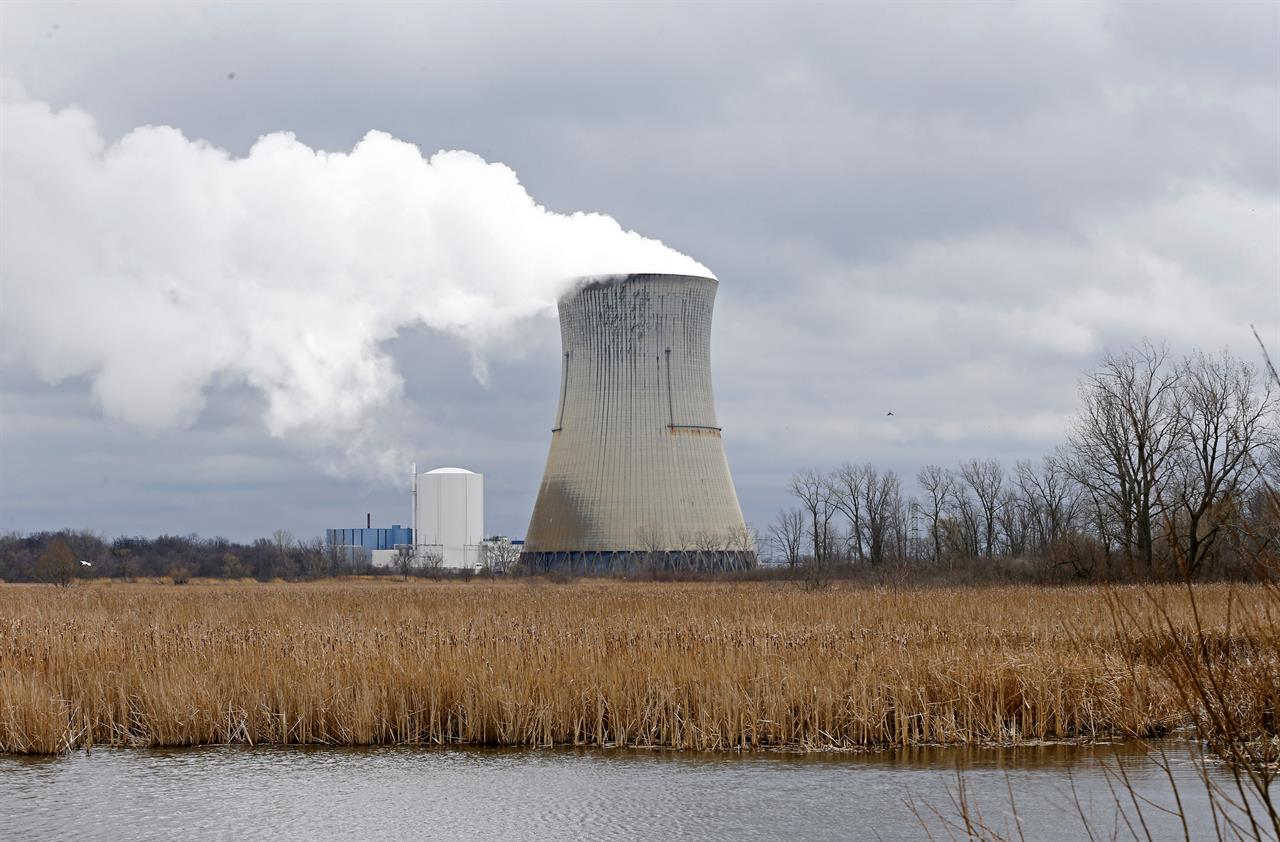 FILE – This April 4, 2017, file photo shows the entrance to FirstEnergy Corp.'s Davis-Besse Nuclear Power Station in Oak Harbor, Ohio. Ohio’s attorney general has filed a lawsuit attempting to block the state’s nuclear plants from collecting fees on electricity bills that were authorized in a new law. Attorney General Dave Yost filed the lawsuit Wednesday, Sept. 23, 2020 in Franklin County Court against Energy Harbor. (AP Photo/Ron Schwane, file)