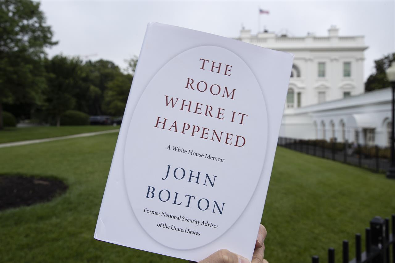 FILE - In this June 18, 2020, file photo a copy of "The Room Where It Happened," by former national security adviser John Bolton, is photographed at the White House in Washington. Trump administration officials repeatedly exerted political pressure in an unsuccessful effort to block the release of former national security adviser John Bolton’s tell-all book, a career government records professional said in a court filing Wednesday, Sept. 23. (AP Photo/Alex Brandon, File)