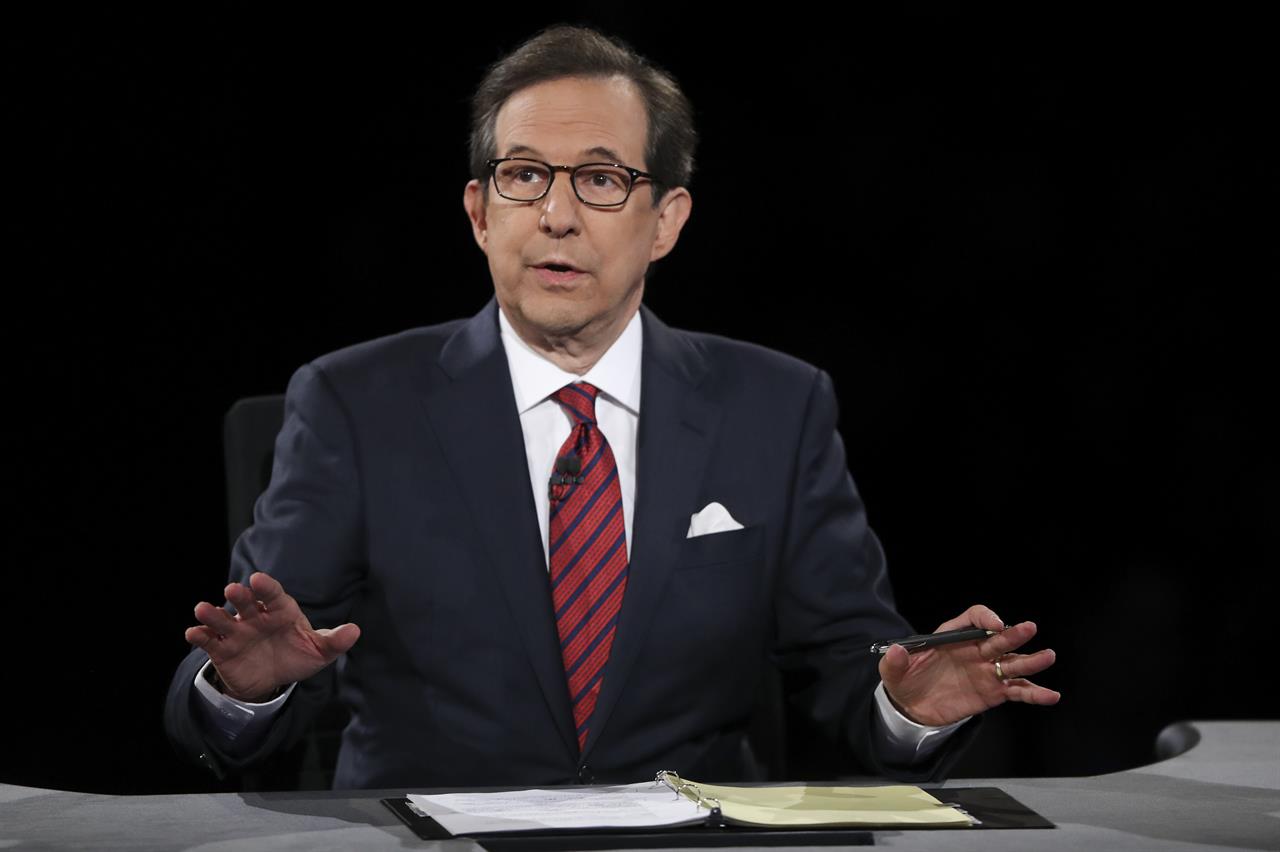 FILE - In this Oct. 19, 2016 file photo, moderator Chris Wallace guides the discussion during the presidential debate at UNLV in Las Vegas. All eyes are on Fox's Chris Wallace as he prepares to moderate the first presidential debate. Wallace is the only journalist moderating one of the four debates this fall who has been there before: he was the onstage referee for the third meeting between President Donald Trump and Hillary Clinton. (Joe Raedle/Pool via AP, File)