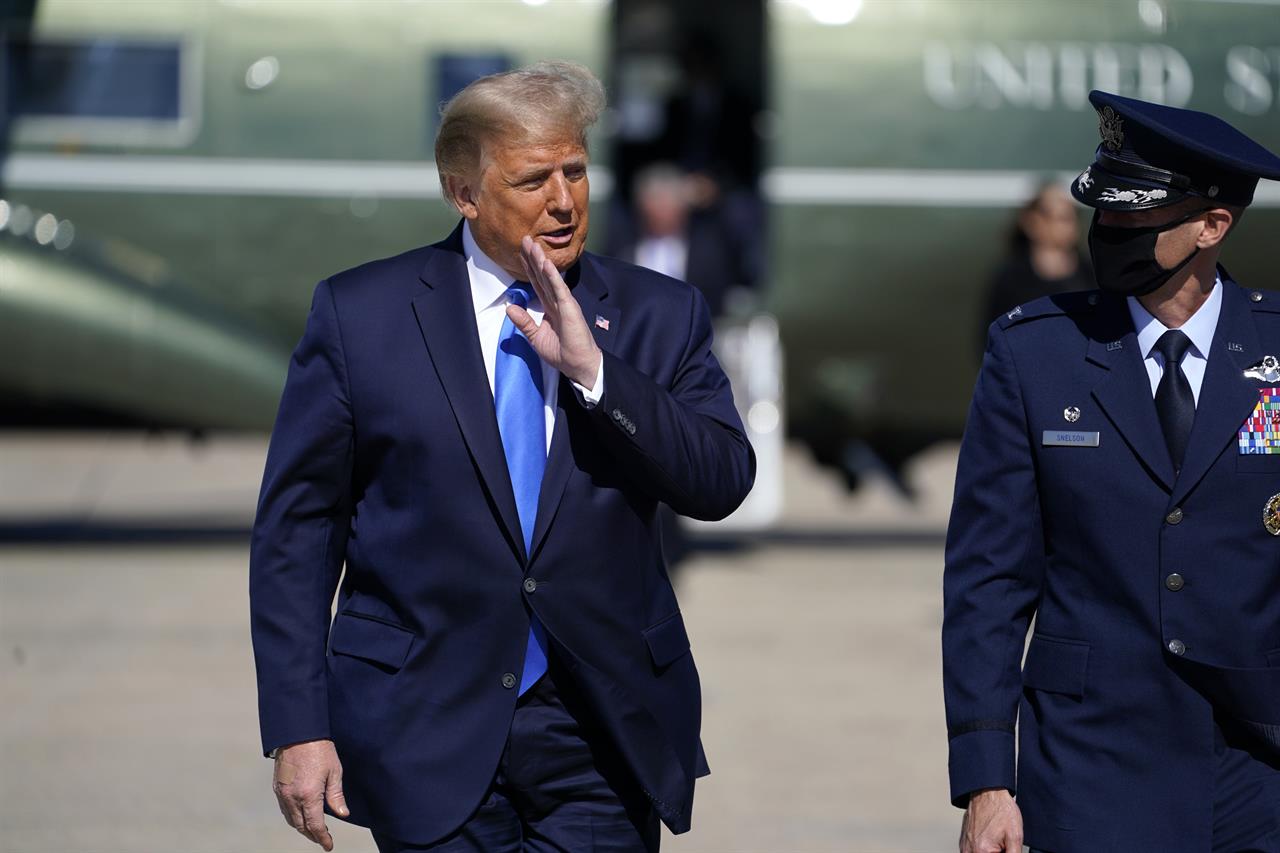 President Donald Trump walks to board Air Force One for a trip to Greenville, N.C. to attend a campaign rally, Oct. 15, 2020, in Andrews Air Force Base, Md. (AP Photo/Evan Vucci)