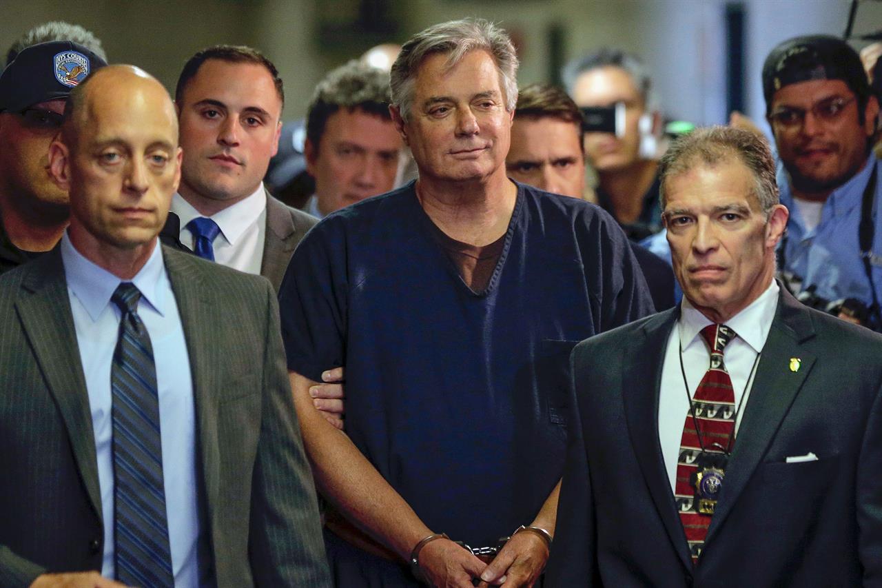 FILE - In this June 27, 2019 file photo, Paul Manafort, center, arrives at court in New York. In paperwork made public on Thursday, July 2, 2020. New York appellate judges on Thursday, Oct. 22, 2020, have upheld a lower judge’s decision to dismiss state mortgage fraud charges against Paul Manafort on double jeopardy grounds. (AP Photo/Seth Wenig, File)