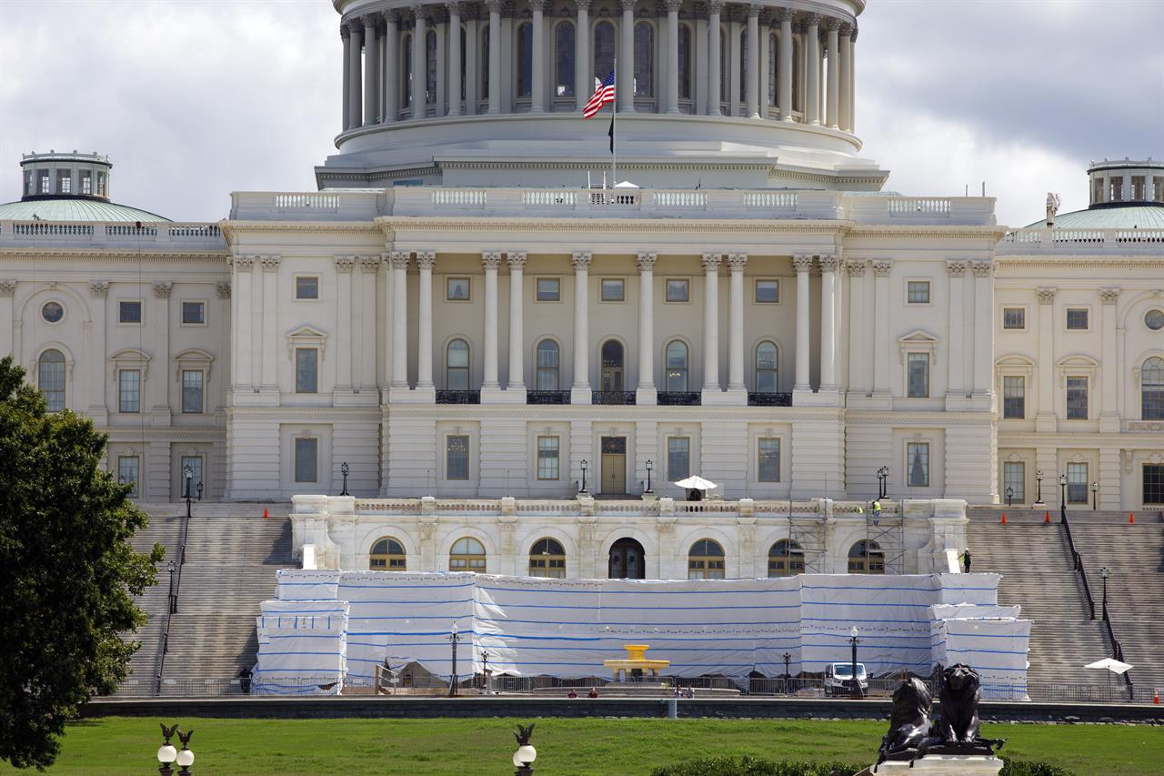 The West Front of the U.S. Capitol on Friday, Aug. 7, 2020, in Washington. While much of Washington is twisted in knots over the upcoming election, there’s another contingent already busy trying to figure out how to stage an inauguration for the next president during a pandemic. (AP Photo/Jon Elswick)