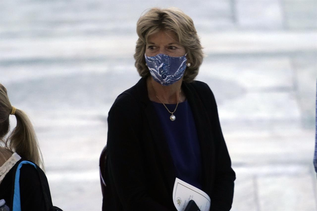 Sen. Lisa Murkowski, R-Alaska, pays respects as Justice Ruth Bader Ginsburg lies in repose under the Portico at the top of the front steps of the U.S. Supreme Court building on Wednesday, Sept. 23, 2020, in Washington. Ginsburg, 87, died of cancer on Sept. 18. (AP Photo/Andrew Harnik, Pool)
