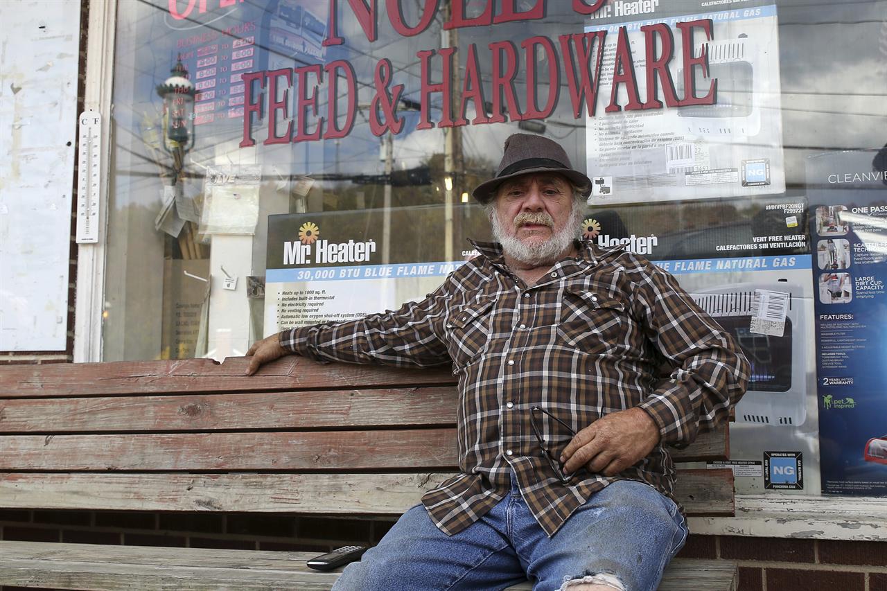 Howard Eakle, 64, discusses the increase in cases of the coronavirus in West Union, W.Va., Wednesday Oct. 21, 2020. (AP Photo/Kathleen Batten)