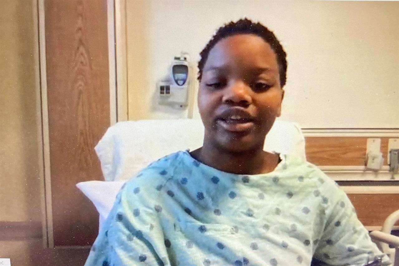 In this image taken from a video screen, Tafara Williams speaks to reporters from her hospital bed during a Zoom meeting Tuesday, Oct. 27, 2020 in Libertyville, Ill. Williams who was injured in a police shooting in suburban Chicago says she begged officers to help her boyfriend, who was also shot and eventually died. Williams and Marcellis Stinnette, a Black man, were shot last week while in a car in Waukegan, north of Chicago. (Zoom via AP Photo)