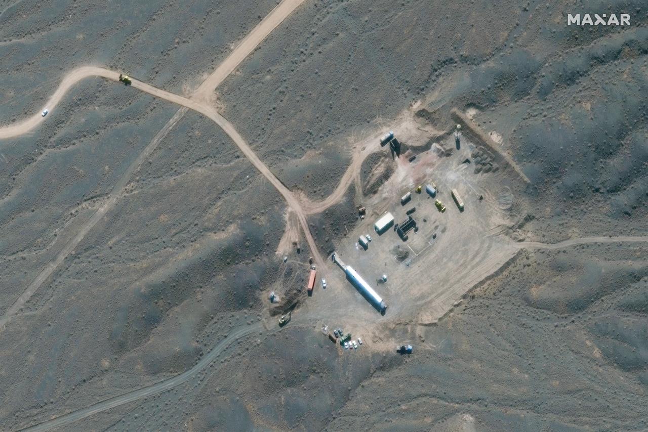 In this Wednesday, Oct. 21, 2020, satellite photo provided by Maxar Technologies, shows construction at Iran's Natanz uranium-enrichment facility that experts believe may be a new, underground centrifuge assembly plant. Satellite photos show Iran has begun construction at its Natanz nuclear facility. That's after the head of the U.N.'s nuclear agency acknowledged Tehran is building an underground advanced centrifuge assembly plant after its last one exploded in a reported sabotage attack last summer. (Satellite image ©2020 Maxar Technologies via AP)