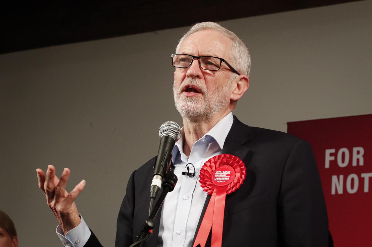 FILE - In this Wednesday, Dec. 11, 2019 file photo, Labour Leader Jeremy Corbyn addresses an eve of poll rally in London. Britain’s equalities watchdog said Thursday, Oct. 29, 2020 that officials in the country’s main opposition Labour Party failed to stamp out anti-Semitism and committed “unlawful acts of harassment and discrimination” against the Jewish community. Labour has faced allegations that anti-Semitism was allowed to fester under the 2015-2019 leadership of Jeremy Corbyn, a long-time supporter of Palestinians and a critic of Israel. (AP Photo/Thanassis Stavrakis, file)