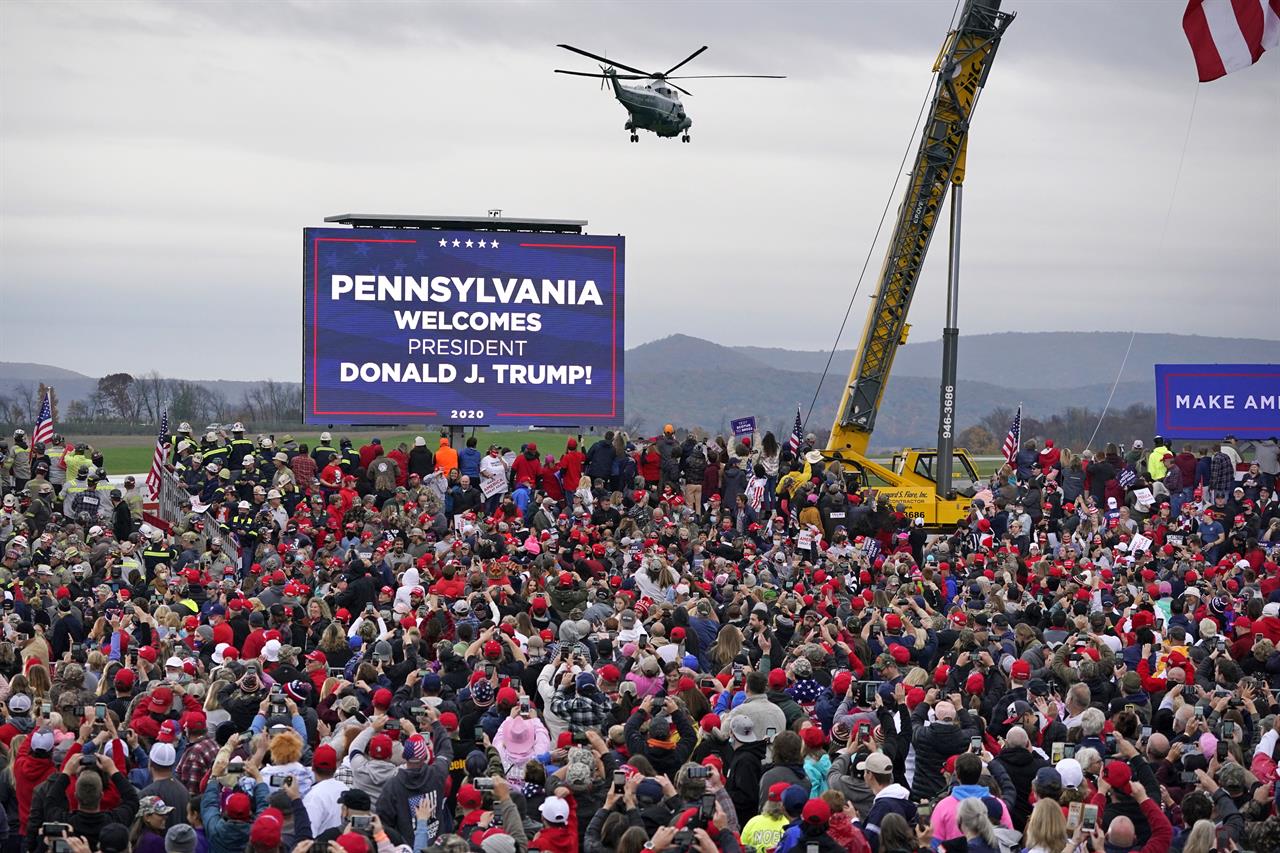 Marine One helictopter, with President Donald Trump aboard, lands at the Altoona-Blair County Airport in Martinsburg, Pa, Monday, Oct. 26, 2020, for a campaign rally. (AP Photo/Gene J. Puskar)