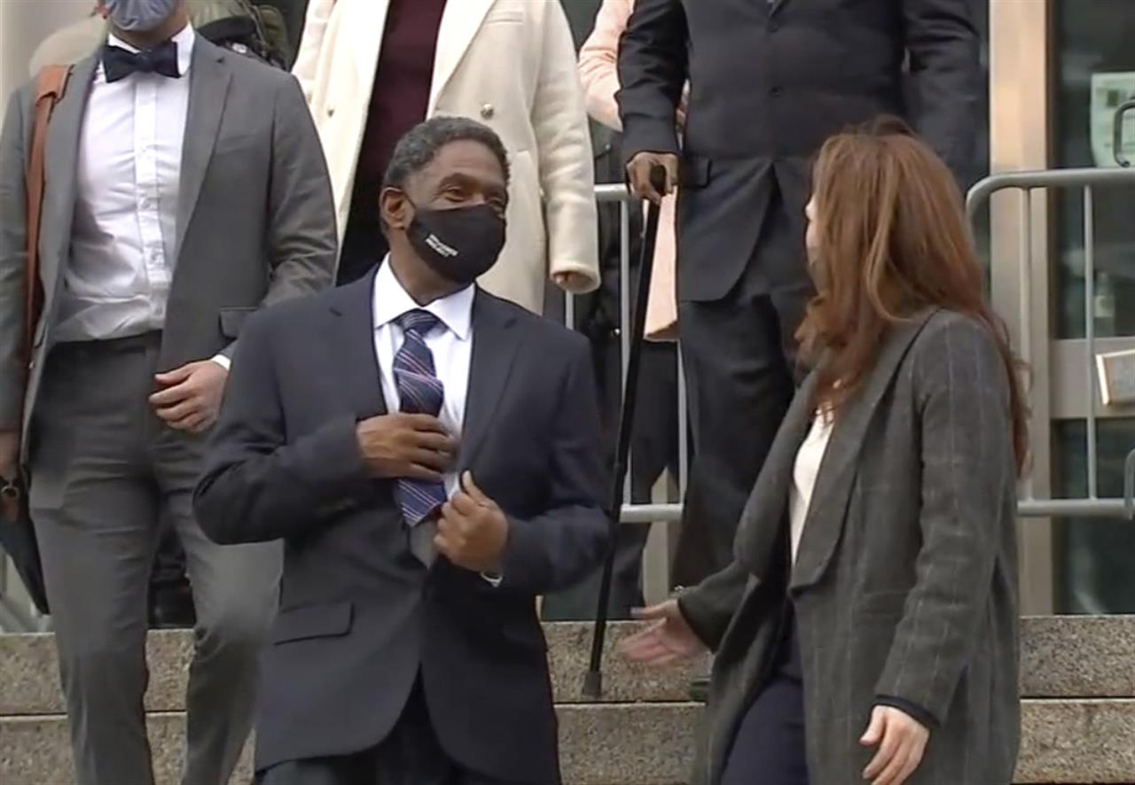 In this image made from video provided by WABC TV, Jaythan Kendrick, center, leaves the courthouse Thursday, Nov. 19, 2020, in New York, after being cleared of the November 1994 killing of Josephine Sanchez. After more than a quarter-century behind bars for the deadly purse-snatching, the New York man has been cleared as prosecutors acknowledged that witnesses against him, including a 10-year-old boy, weren't reliable. (WABC TV via AP)