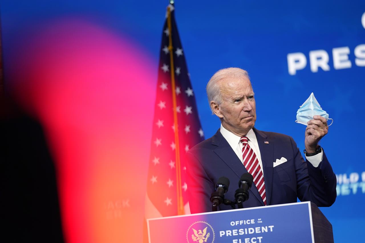 President-elect Joe Biden, accompanied by Vice President-elect Kamala Harris, speaks about economic recovery at The Queen theater, Monday, Nov. 16, 2020, in Wilmington, Del. (AP Photo/Andrew Harnik)