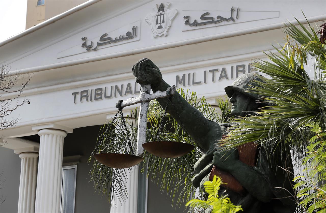 A statue of soldier carries balance, symbol of justice, is seen outside the military court in Beirut, Lebanon, Wednesday, May 27, 2020. A year after anti-government protests roiled Lebanon, dozens of protesters are being tried before military courts that human rights lawyers say grossly violate due process and fail to investigate allegations of torture and abuse. (AP Photo/Hussein Malla)