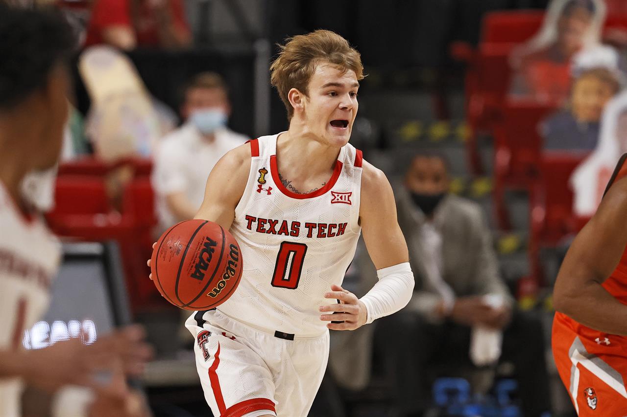 Texas Tech's Mac McClung (0) dribbles the ball down the court during the first half of an NCAA college basketball game against Sam Houston State, Friday, Nov. 27, 2020, in Lubbock, Texas. (AP Photo/Brad Tollefson)