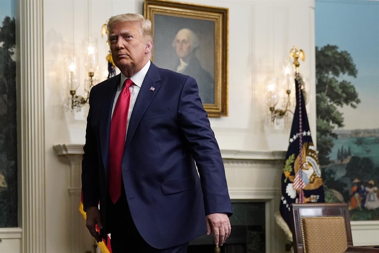 President Donald Trump departs after participating in a video teleconference call with members of the military on Thanksgiving, Thursday, Nov. 26, 2020, at the White House in Washington. (AP Photo/Patrick Semansky)