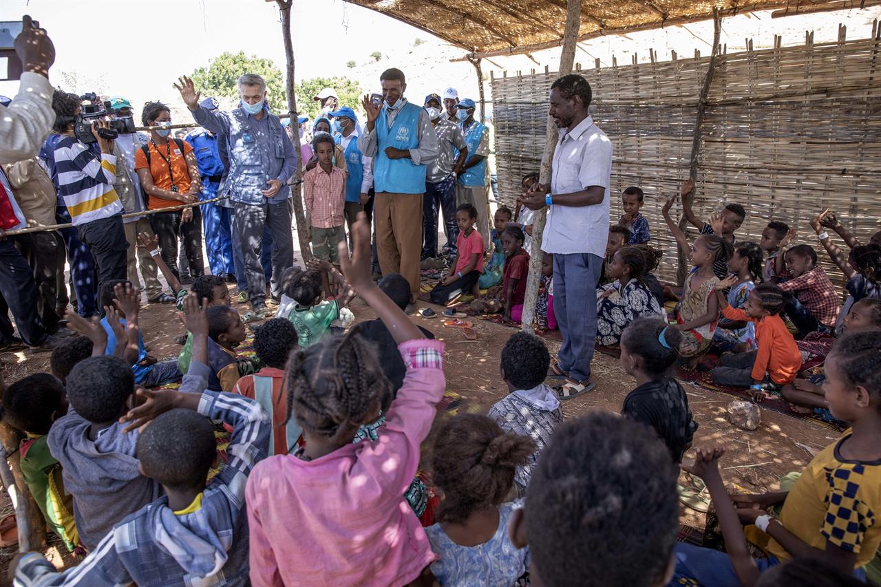 Filippo Grandi, U.N. High Commissioner for Refugees, visits Umm Rakouba refugee camp sheltering people who fled the conflict in Ethiopia's Tigray region in Qadarif, eastern Sudan, Saturday, Nov. 28, 2020. (AP Photo/Nariman El-Mofty)