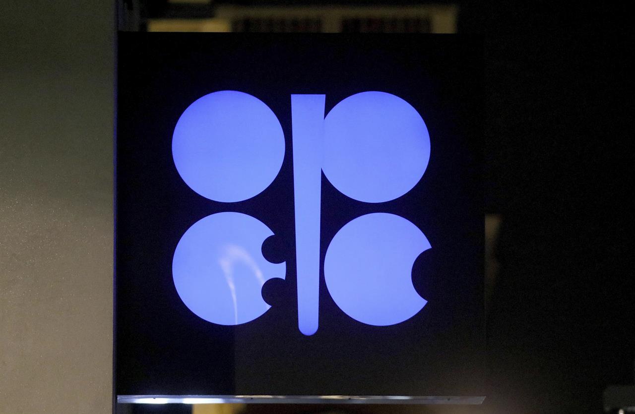 FILE - In this Dec. 19, 2019 file photo, the advertising label of the Organization of the Petroleum Exporting Countries, OPEC, shines at their headquarters in Vienna, Austria. Leaders of the OPEC cartel are meeting virtually to decide how much oil their countries should produce as the coronavirus stifles demand for fuel. They’re expected to extend production cuts into the new year in an effort to boost prices. (AP Photo/Ronald Zak, File)