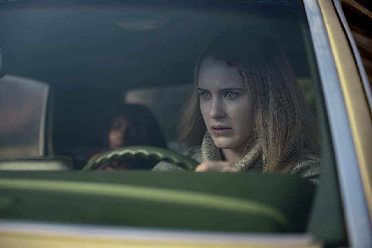 Marsha Stephanie Blake, background left, and Rachel Brosnahan appear in a scene from the film "I'm Your Woman." (Wilson Webb/Amazon Studios via AP)