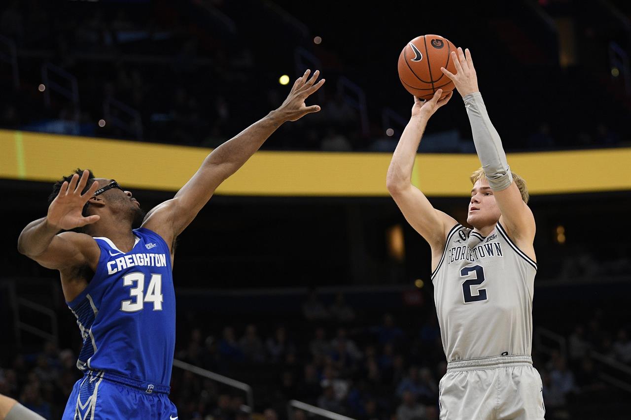 Georgetown guard Mac McClung (2) shoots as he is defended by Creighton guard Denzel Mahoney (34) during the second half of an NCAA college basketball game, Wednesday, Jan. 15, 2020, in Washington. Georgetown won 83-80. (AP Photo/Nick Wass)
Georgetown's Mac McClung to test NBA waters, could return
